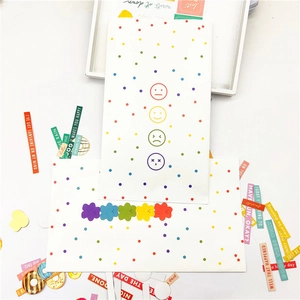 Polka dot paper gift bags with colorful inspirational quote stickers for packaging