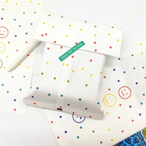 Colorful polka dot kraft paper gift bag with happy smiley icons and sealing sticker