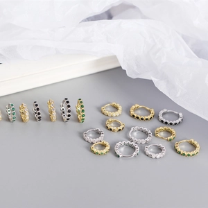 Macro detail of S925 sterling silver hoop earrings with micro-set colorful zircon stones