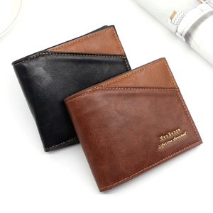 Detail of bifold wallets with contrast stitching and embossed gold lettering logo
