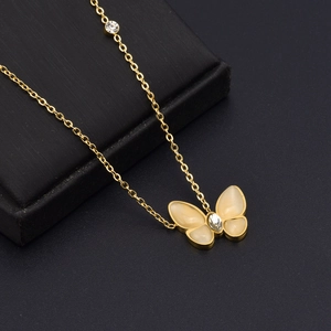 Elegant rose gold butterfly pendant necklace with cat-eye stone and crystal accents