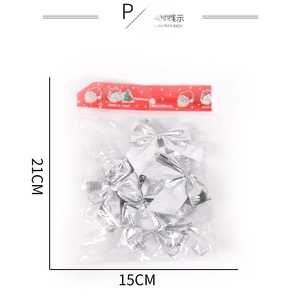 Silver glitter Christmas tree bows in retail packaging with holiday header card