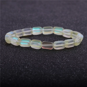 Detailed view of aurora moonstone beads with iridescent finish on a beaded bracelet
