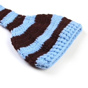 Macro view of blue and brown striped knit texture on a newborn photography Christmas hat