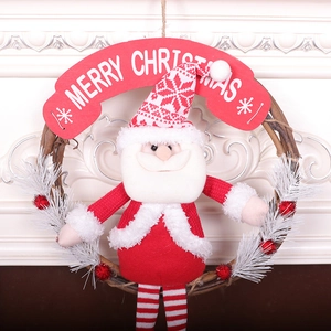 Christmas wreath with Santa plush doll, red white long legs, and Merry Christmas sign
