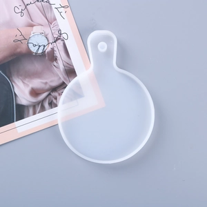 Detailed top view of a translucent round silicone resin mold with a handle hole