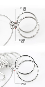 Macro detail of metal ring sizer gauges showing engraved US and EU size measurements