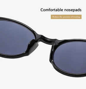 Close-up of integrated black nose pads on stylish round frame sunglasses for comfort