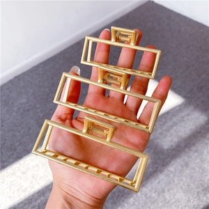 Set of three matte gold geometric rectangular metal hair claws in various sizes