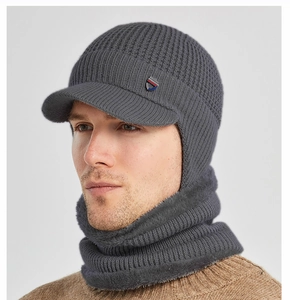 Detailed close-up of men's winter knit beanie with visor and thick faux fur lining