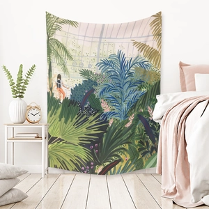 Detail of bohemian tapestry featuring botanical greenhouse art hanging above a bedroom bed