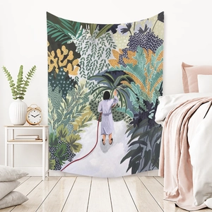 Detail of bohemian tapestry featuring a garden illustration on a bedroom wall decoration
