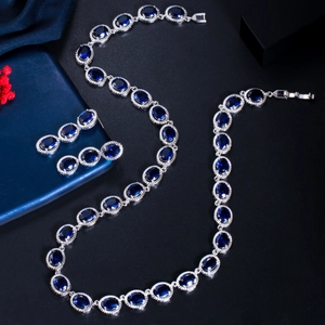 Macro view of blue zircon jewelry set featuring silver 925 hallmarks on the necklace clasp