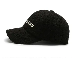 Side view of black fleece baseball cap with white GUARD embroidery and soft texture