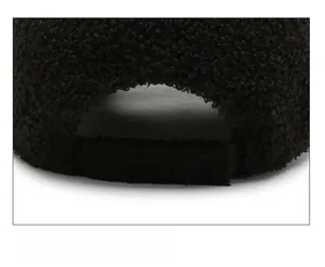 Detail of adjustable strap and warm fleece texture on the back of this black baseball cap