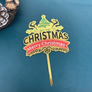 Golden acrylic Merry Christmas cake topper with festive reindeer and tree silhouettes