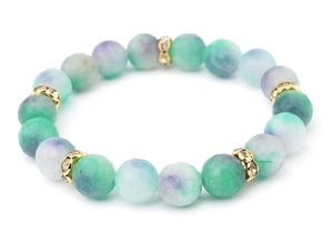 Close-up of natural stone bead bracelet with turquoise texture and gold crystal spacers