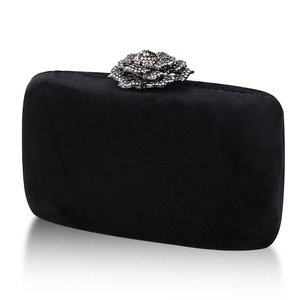 Elegant black velvet evening clutch with crystal flower clasp and sleek chain strap