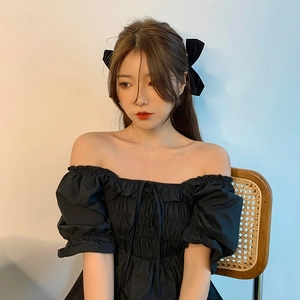 Chic black velvet bow hair clips for women with elegant bubble sleeve dress styling