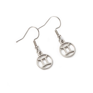 Detailed shot of polished silver Gemini zodiac sign earrings with hollow circular design