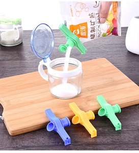 Detail showing colorful plastic sealing clips with pouring spouts for snack bags