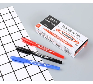 Detail view of dual-tip oil-based markers with fine and extra-fine nibs for multi-surfaces