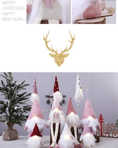 Detail of glowing Christmas gnomes in pink and red with soft knitted fabric and rabbit fur
