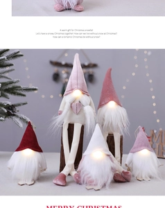 Close-up of glowing LED Christmas gnomes with faux fur texture and holiday decor