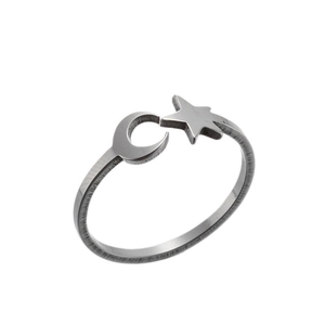 Minimalist stainless steel open ring with moon and star motifs on a white background