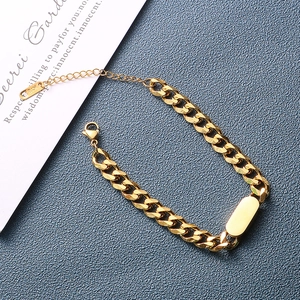 Detailed macro view of 18K gold Cuban link bracelet with rectangle plate and K18 hallmark