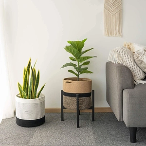 Close-up of woven cotton rope storage baskets in minimalist living room decor