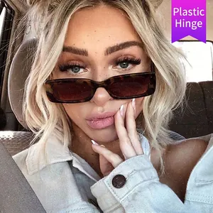 Fashionable tortoise shell rectangle sunglasses with brown lenses worn by female model