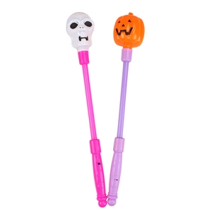 Halloween glowing magic wands set with skull and pumpkin heads in purple and pink colors