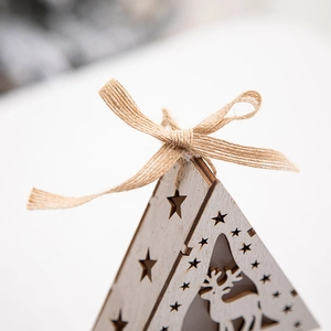Nordic Christmas reindeer wooden pendant with laser-cut star patterns and jute bow knot