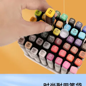 Detail showing hand selecting a professional dual-tip marker from a 80-color art set