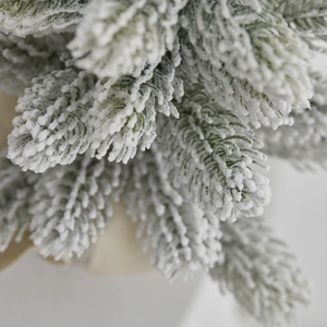 Deep green PE flocked mini Christmas tree with lifelike white snow needles for tabletop
