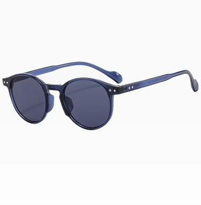 Detail view of round sunglasses with transparent blue frame and dark gray lenses