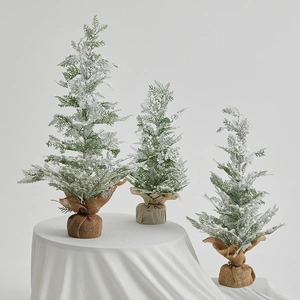 Three-piece set of flocked mini Christmas trees with burlap bases for tabletop decoration