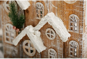 Macro detail of wooden Christmas house with realistic snow texture and pine needles