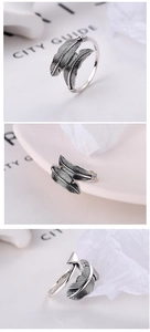 Detailed macro views of S925 sterling silver feather and arrow adjustable open ring