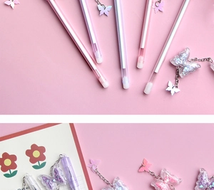 Detail of pink butterfly pendant pen with flowing glitter sand sequins inside