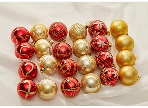 Close-up of 6cm white hand-painted Christmas ornaments with glitter patterns