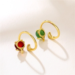Adjustable gold plated fox ring with red and green garnets and cat ear design features
