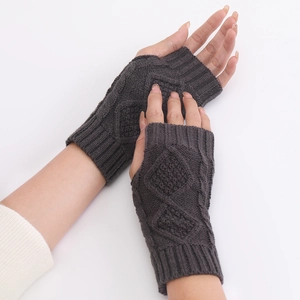 Detail of charcoal grey diamond cable knit half-finger gloves with ribbed cuffs for women