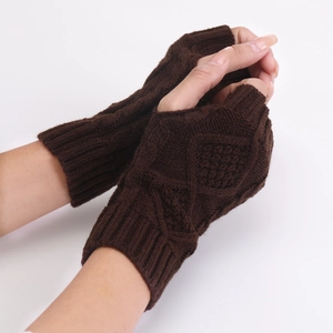 Close-up of dark brown cable knit fingerless gloves with diamond pattern and ribbed cuffs