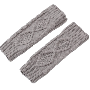 Detail of gray cable-knit fingerless gloves featuring a diamond pattern and ribbed cuffs
