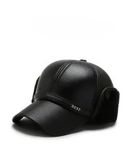 Detail of winter baseball cap with ear flaps featuring black leather and BEST embroidery