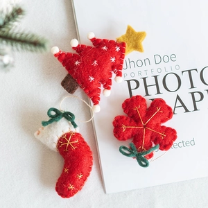 Christmas wool felt ornaments set featuring tree and sock shapes with gold embroidery