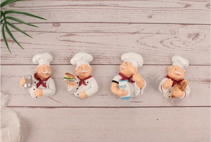 Set of four cartoon chef wall hooks for kitchen cord storage on wood background