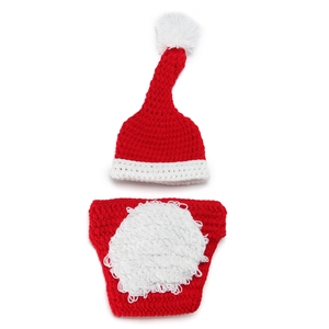Detail of handmade knit Santa long-tail hat and red diaper cover for newborn photography